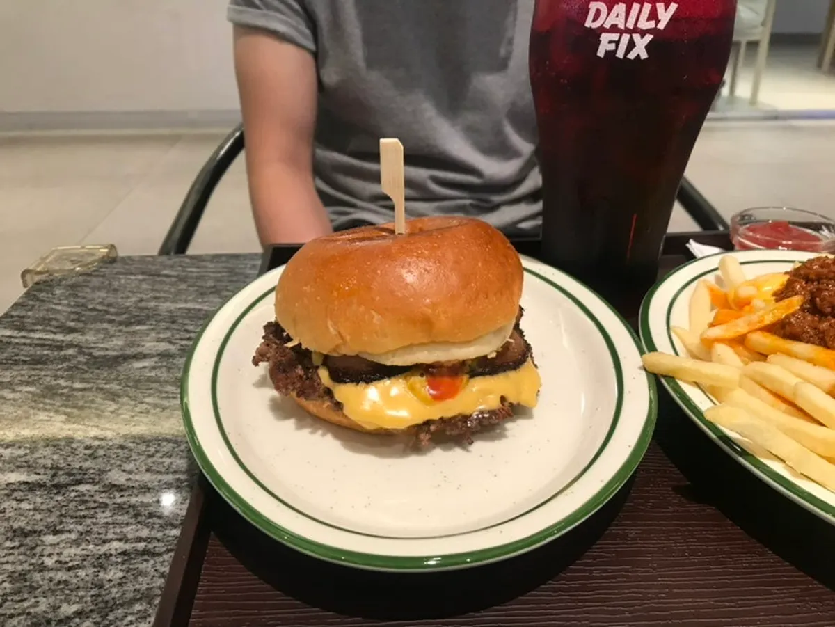 Table spread of Daily Fix Hannam's burger and fries