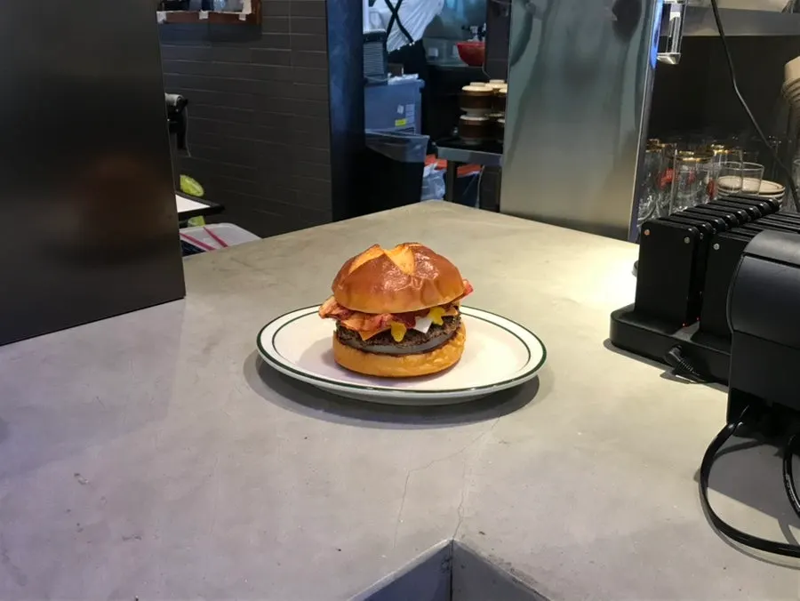Sign introducing Daily Fix's hanwoo patty and homemade bacon