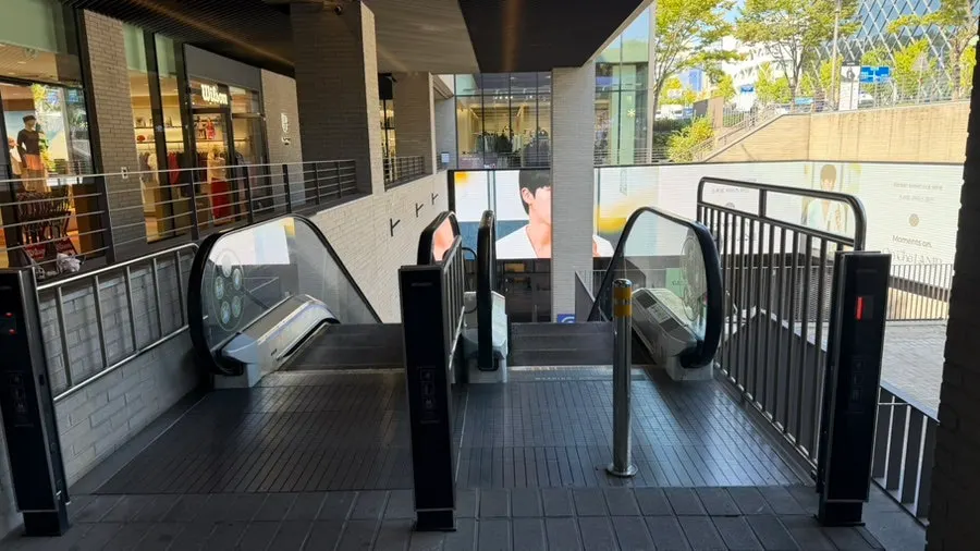 Escalator descending to the basement food court at Nine One Hannam