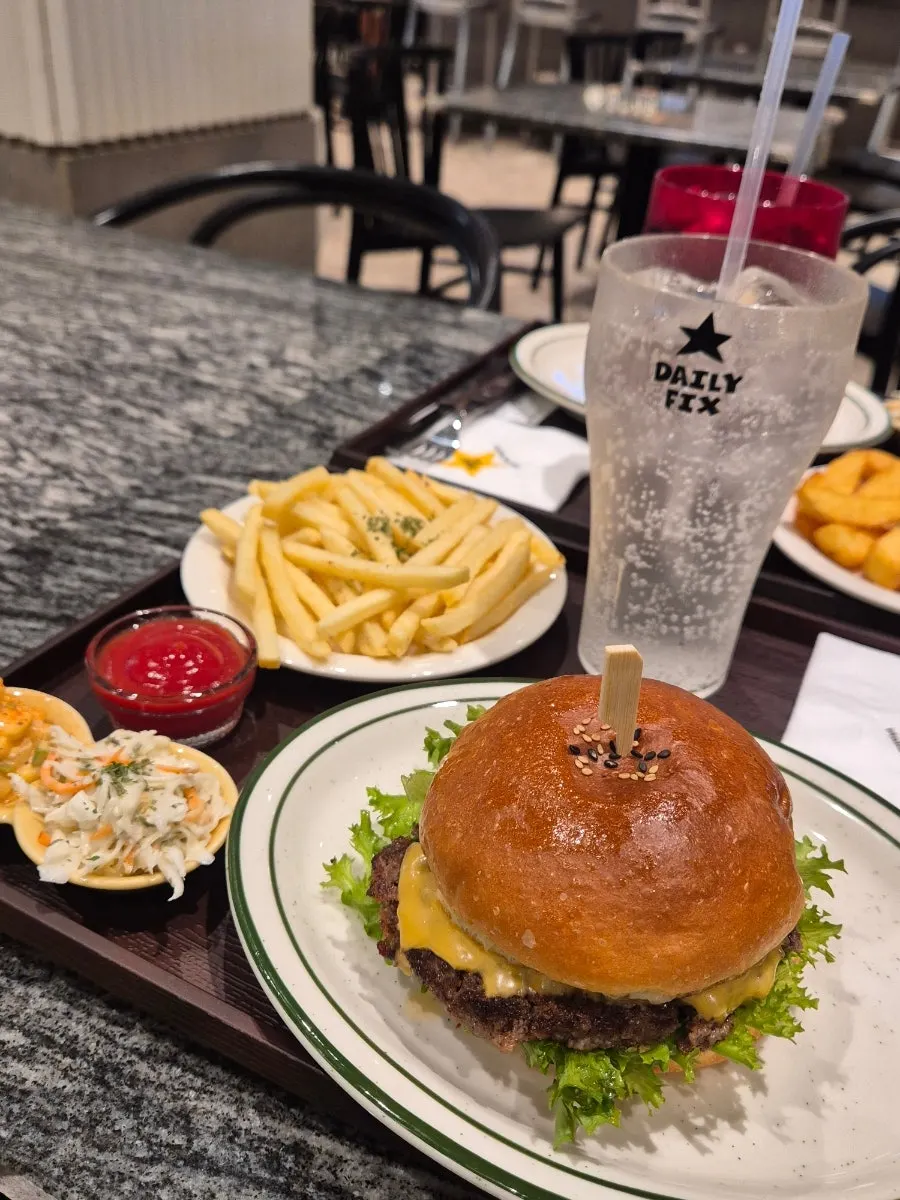 Handmade burger served as a set with fries