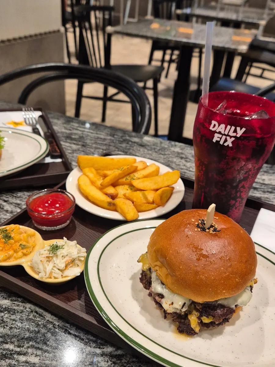 Daily Fix handmade burger with a butter-toasted bun