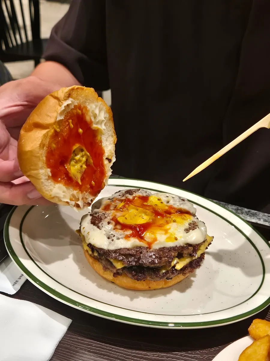 Close-up of melted cheese in the double cheeseburger