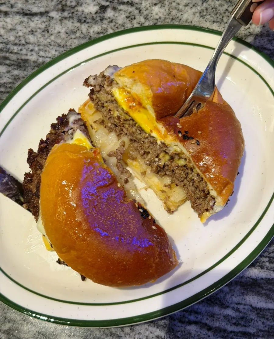 Double cheeseburger layered with American and Swiss cheese