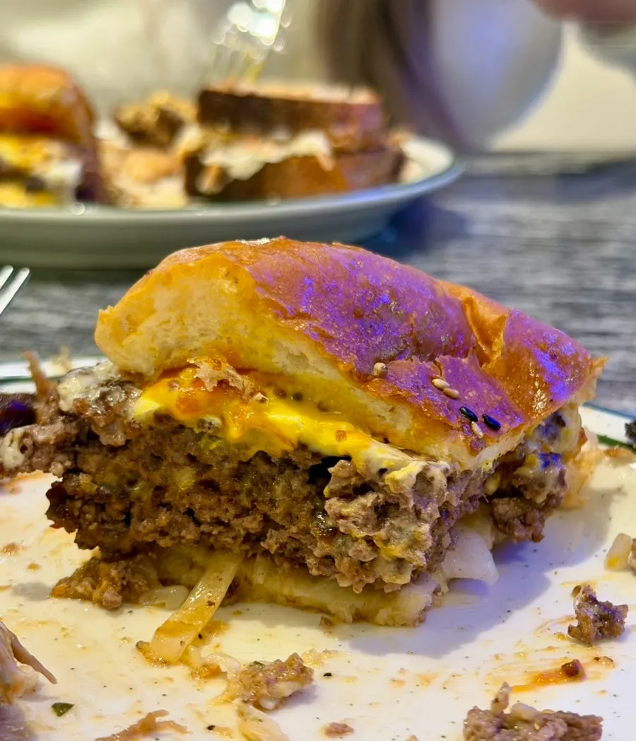 Cross-section of a bitten double cheeseburger