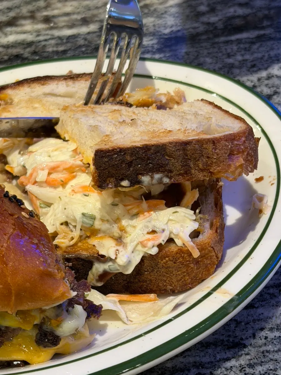 Cross-section of a pulled pork sandwich cut in half