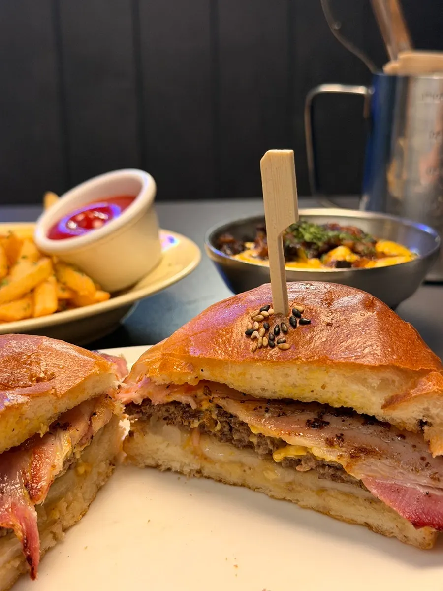 Cross-section of the bacon cheeseburger showing the Korean beef patty