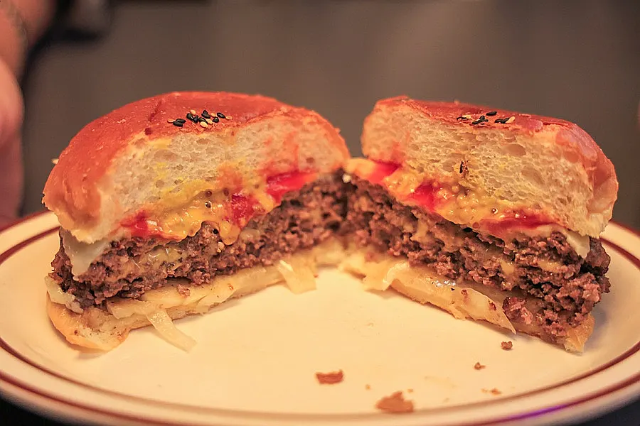 Cross-section of the double cheeseburger with two stacked patties
