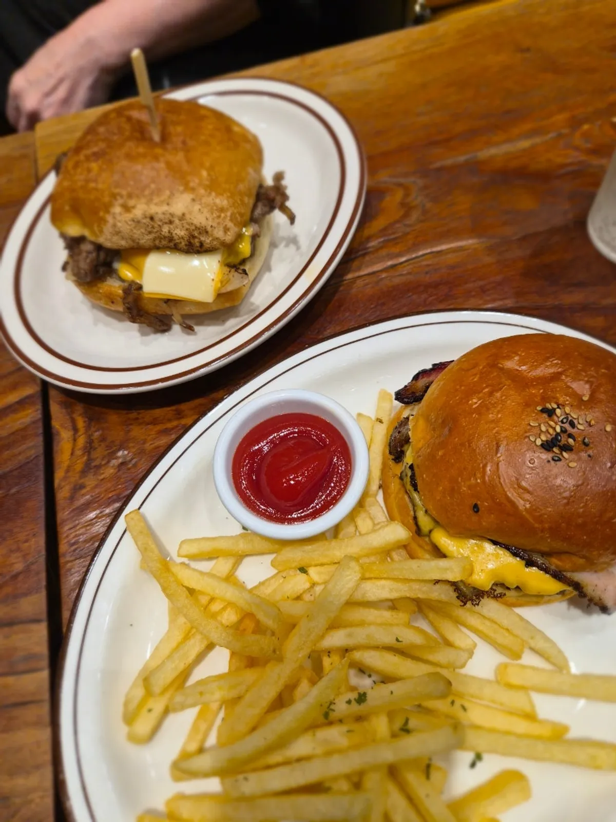 Table setting with the bacon cheeseburger set and Philly cheesesteak sandwich