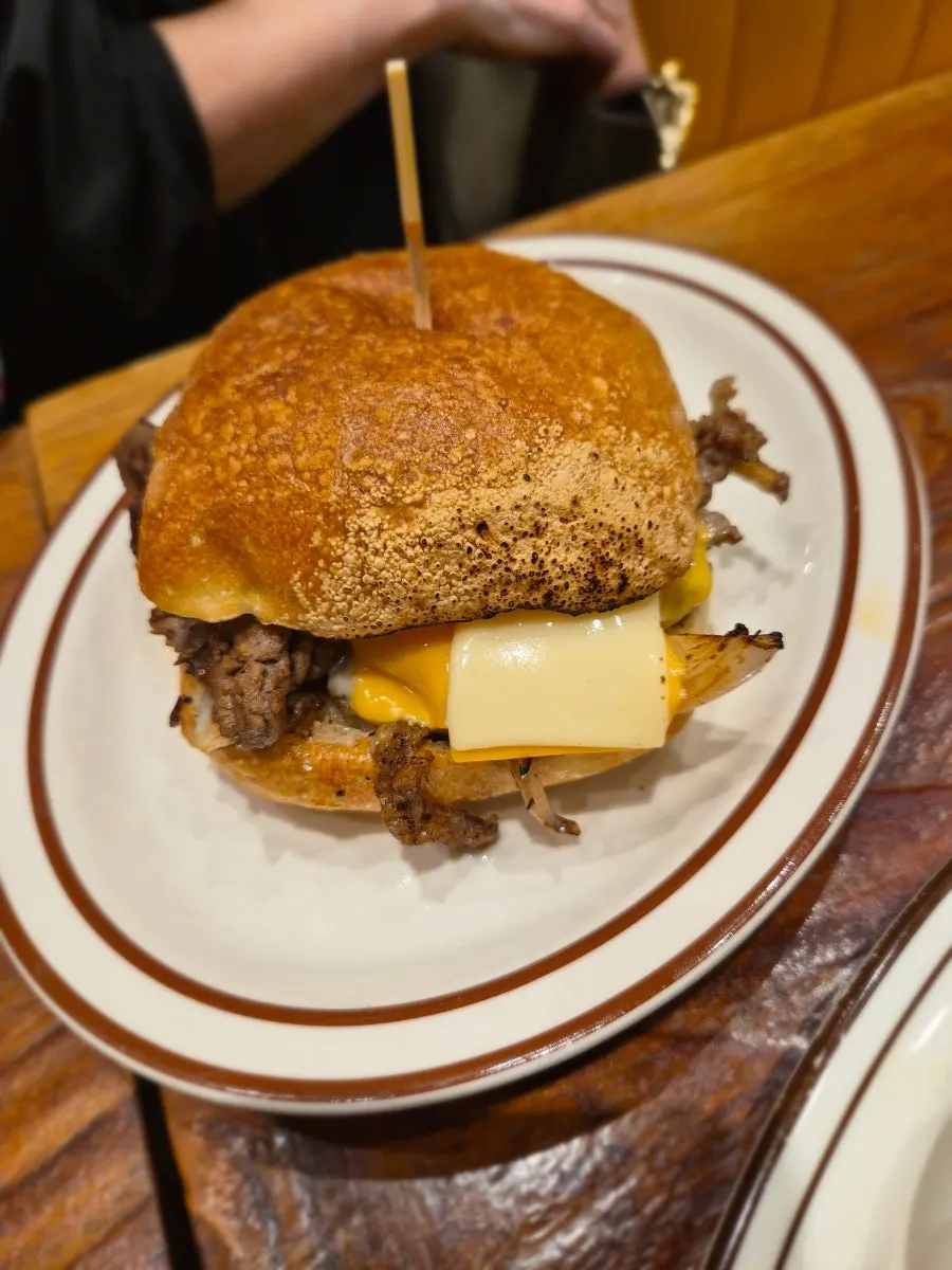 Table with the sandwich and a drink
