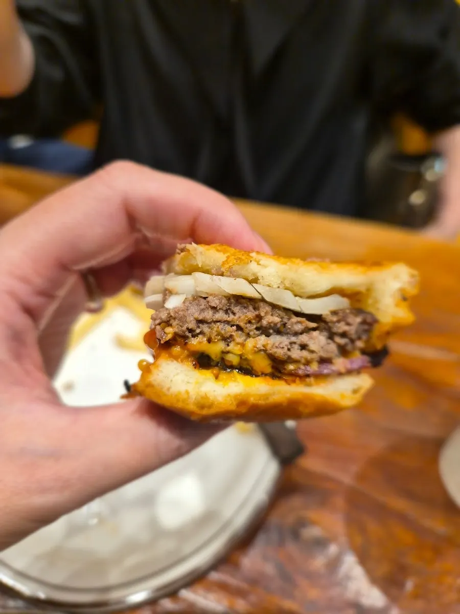 Full table spread of the burger and sides
