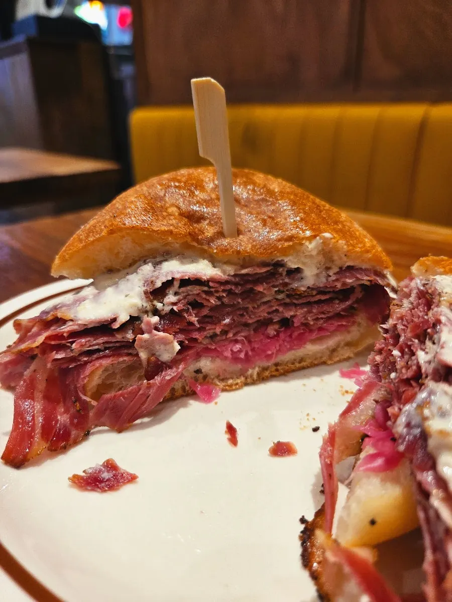 Close-up of the crispy bread of the pastrami sandwich