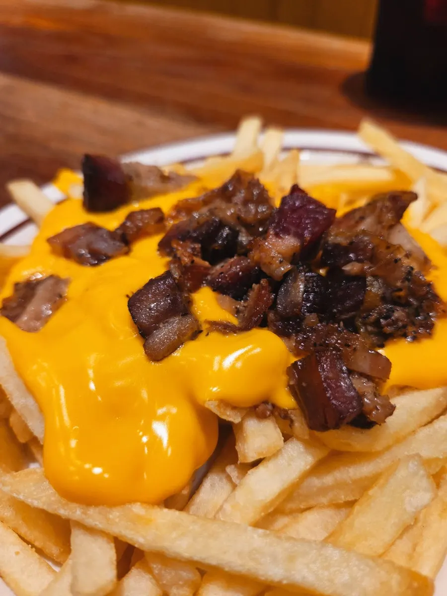 Fries generously covered in cheese