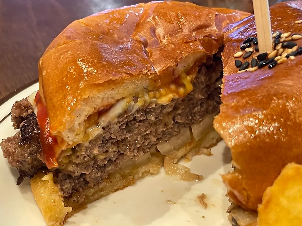 Double cheeseburger with fluffy bun and layered cheese