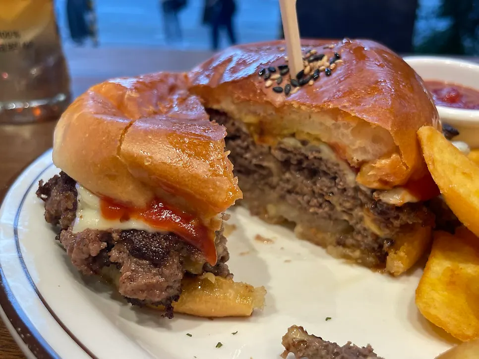 Cross-section of a bitten double cheeseburger