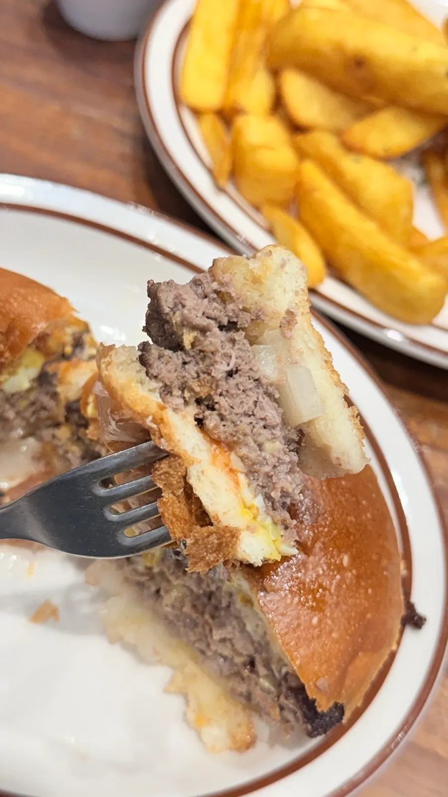 Holding the hearty handmade burger