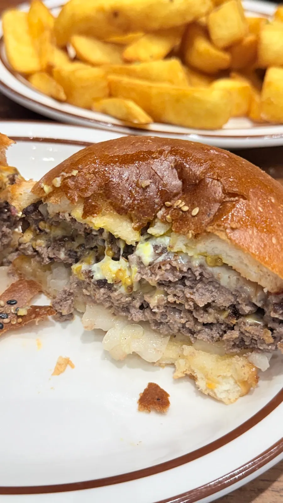 Both burgers set out together on the table