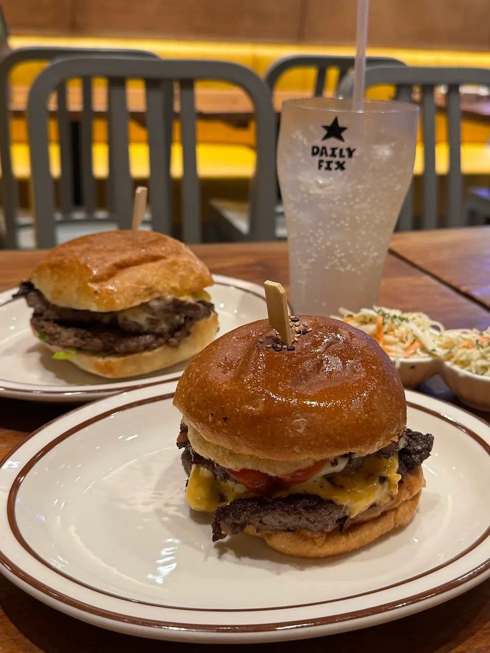 Double cheeseburger with side dishes at Daily Fix