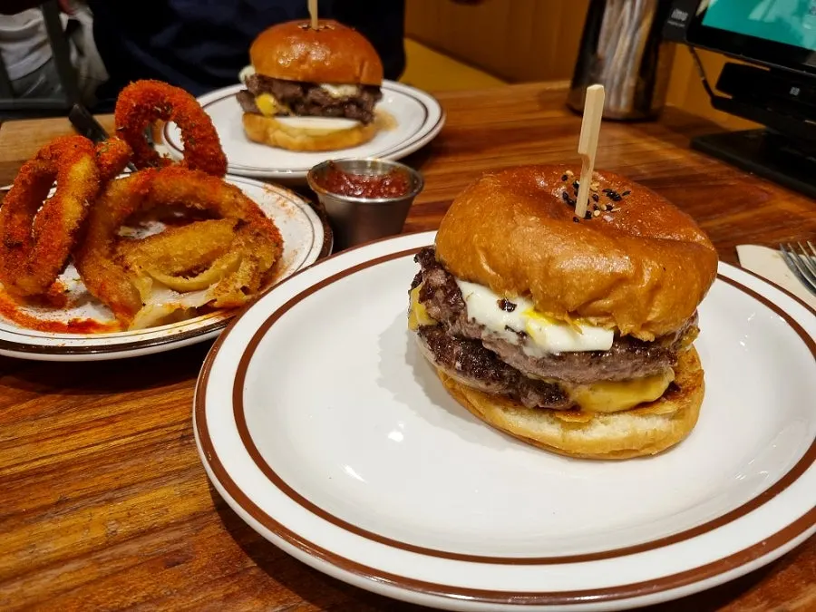 Two double cheeseburgers on the table