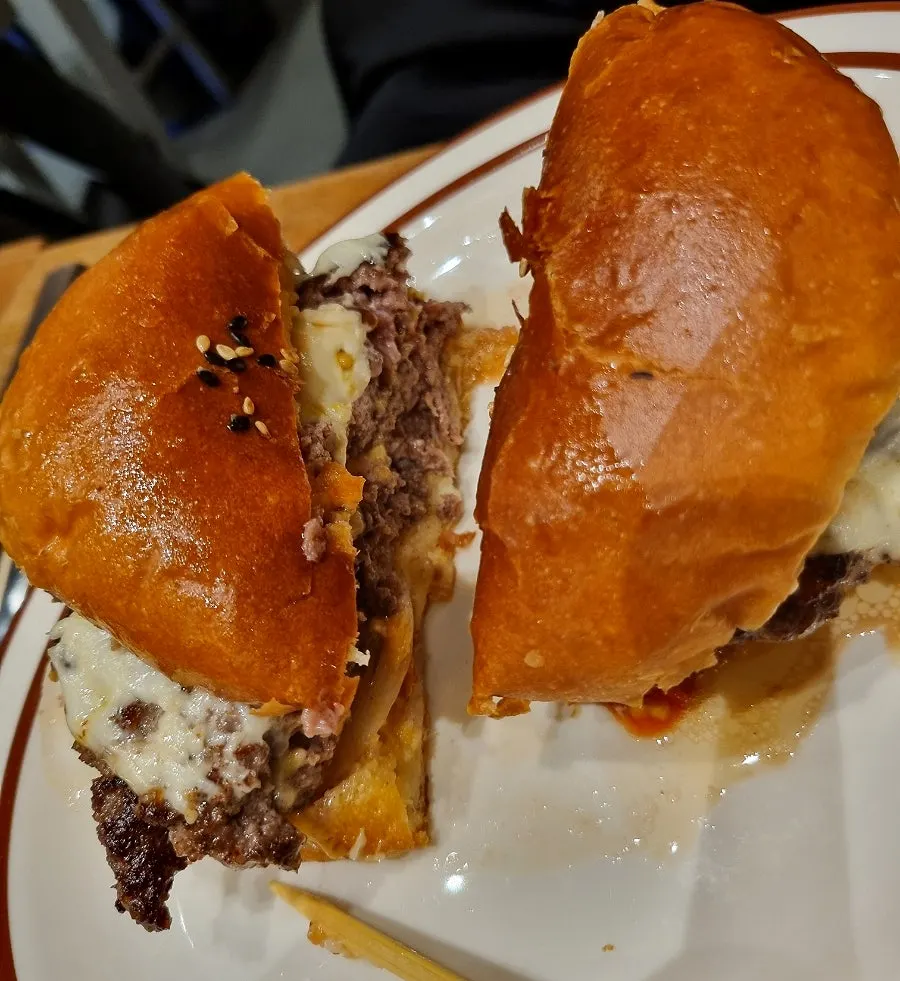 Close-up of the burger with a wooden skewer