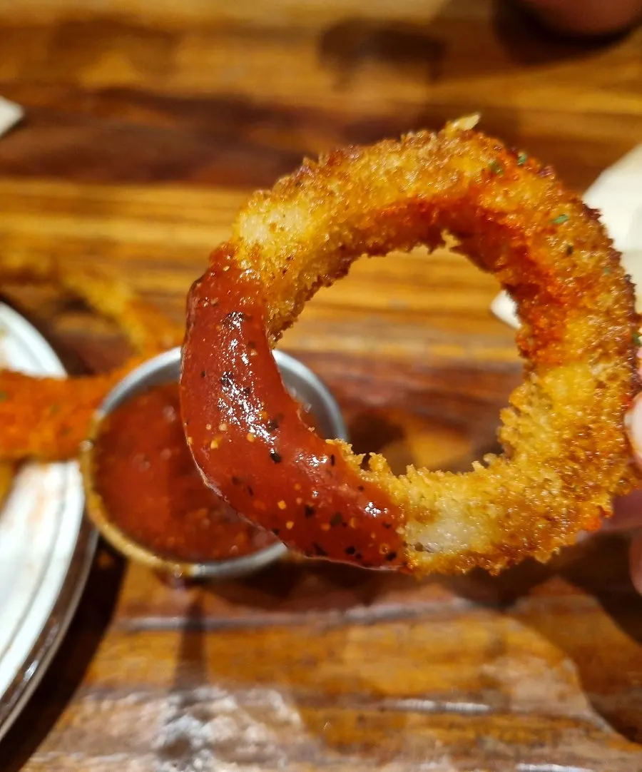 Onion rings dipped in sauce