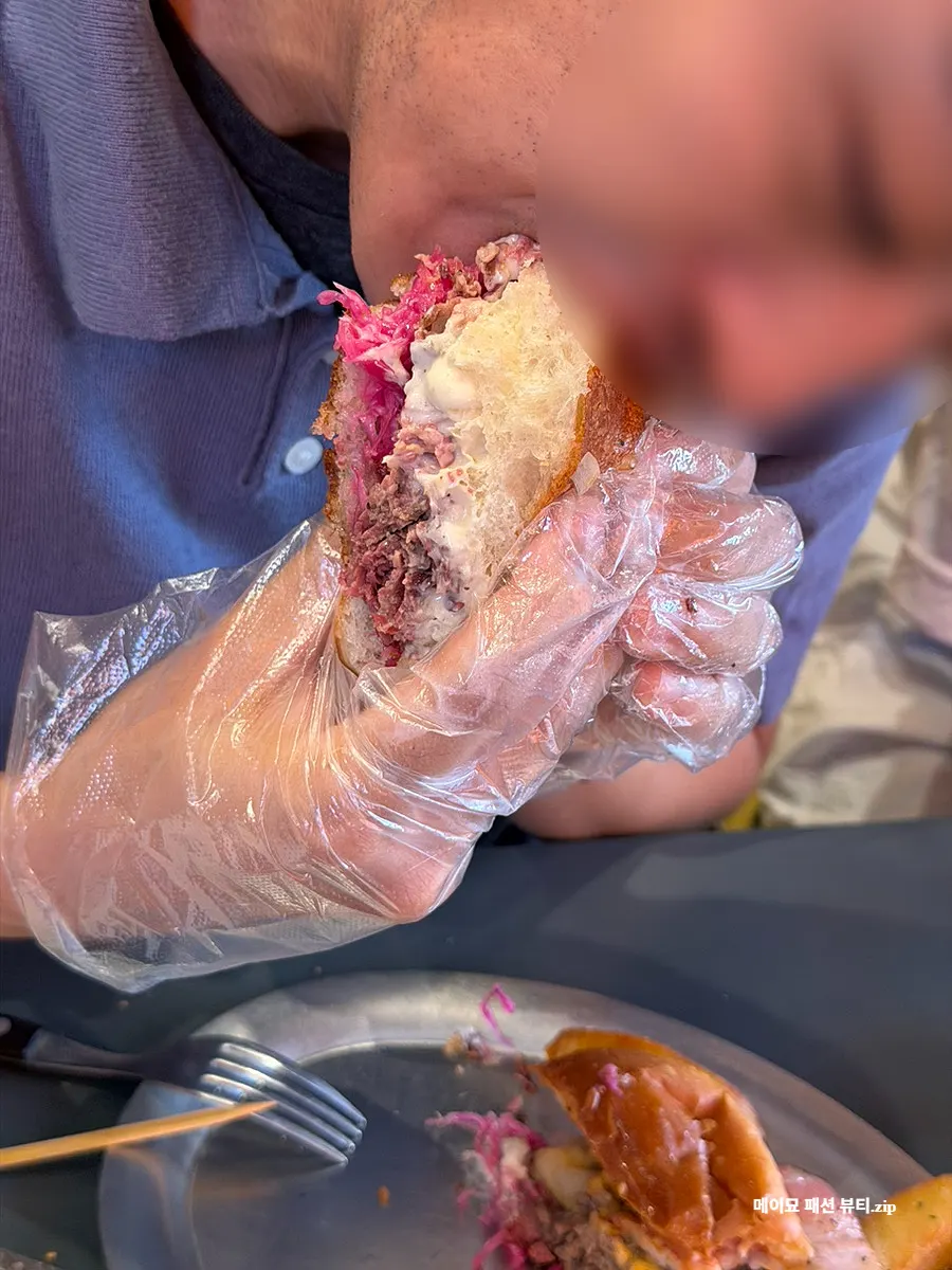 Sandwich showing horseradish sauce and red cabbage pickle