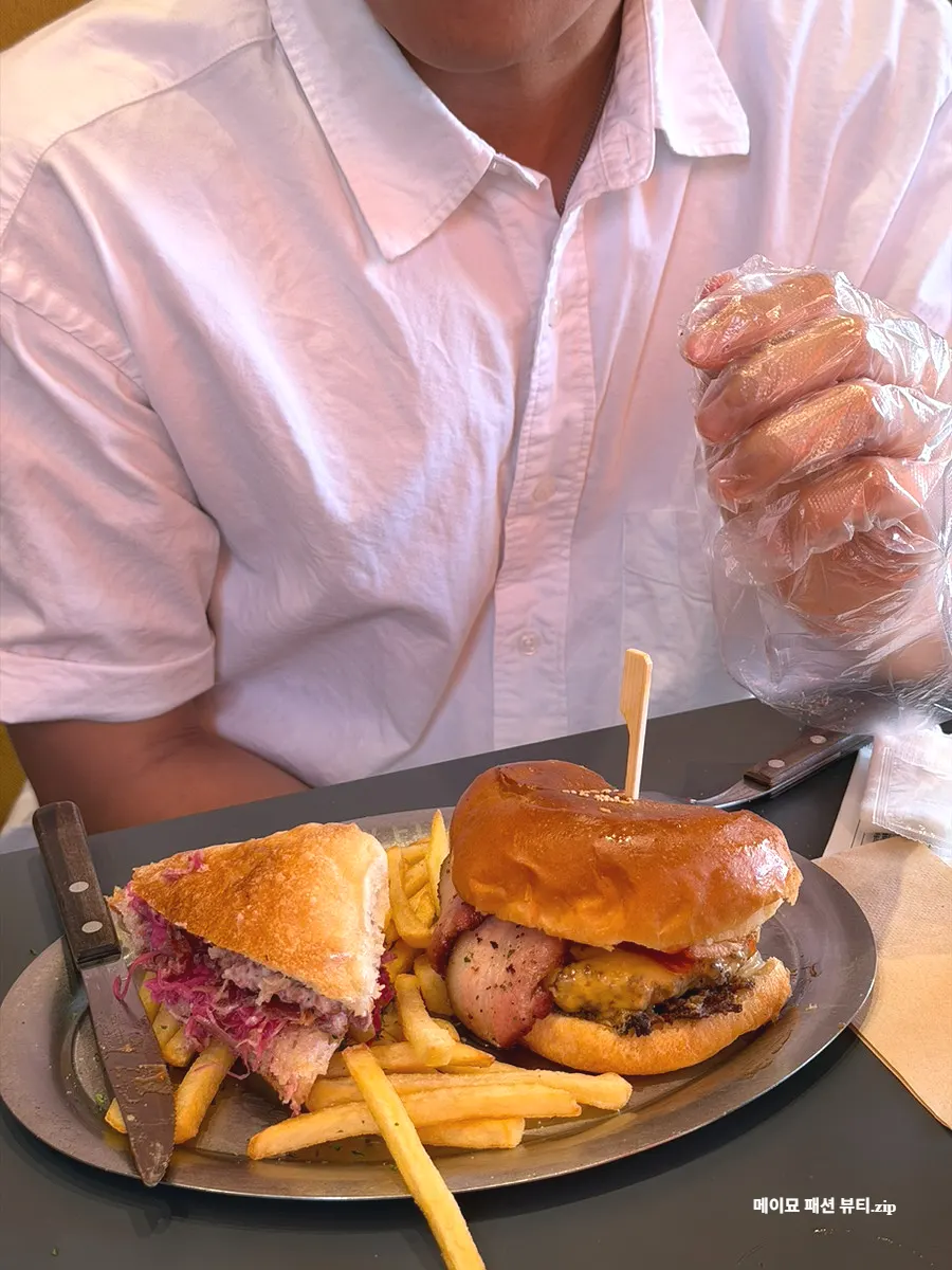 Close-up of the sesame-topped bun on the Bacon Cheese Burger