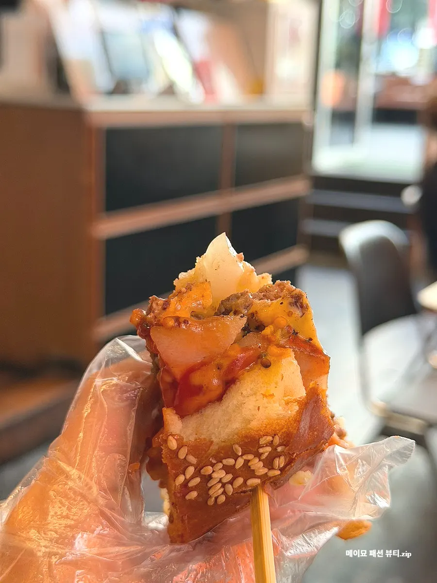 Cross-section of the Bacon Cheese Burger after one bite