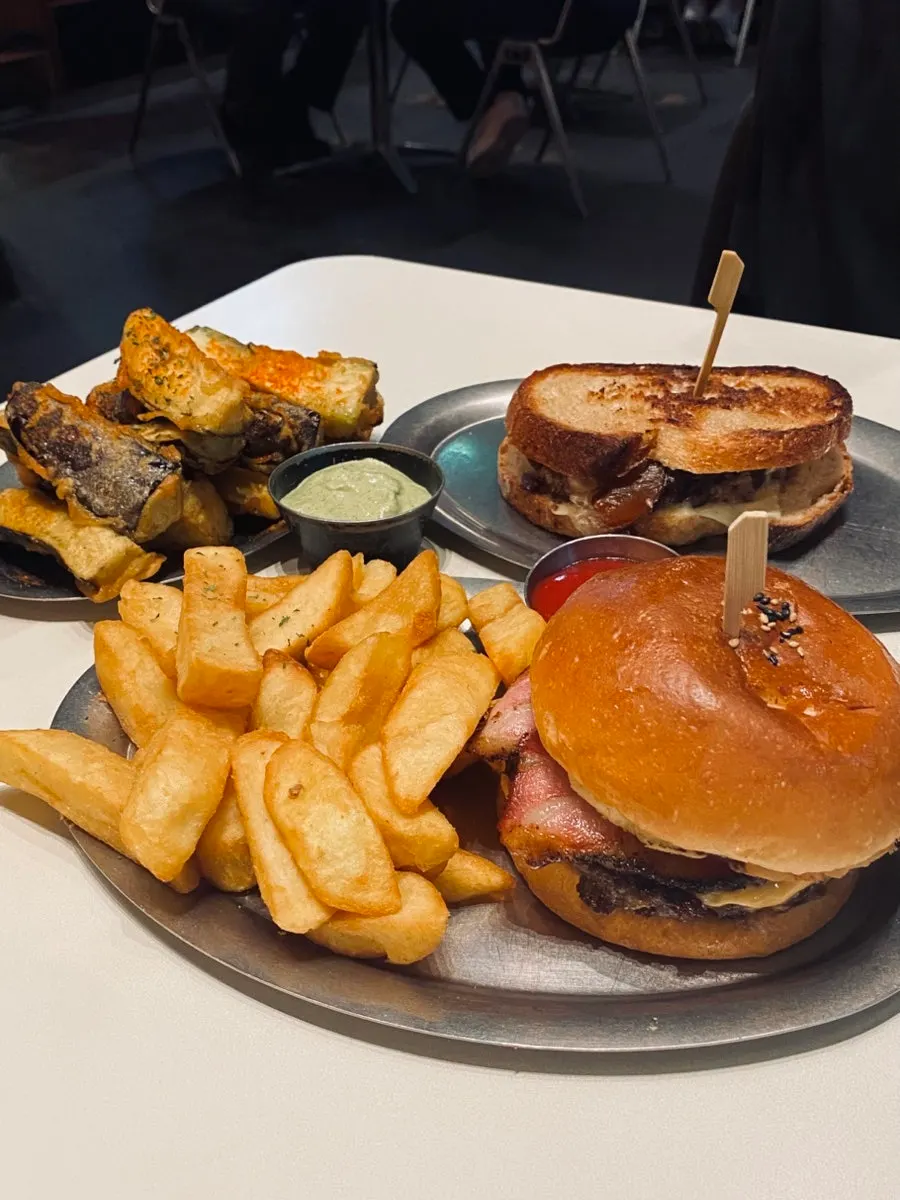 Table set with the ordered burgers and sides at Daily Fix Gangnam Main Branch