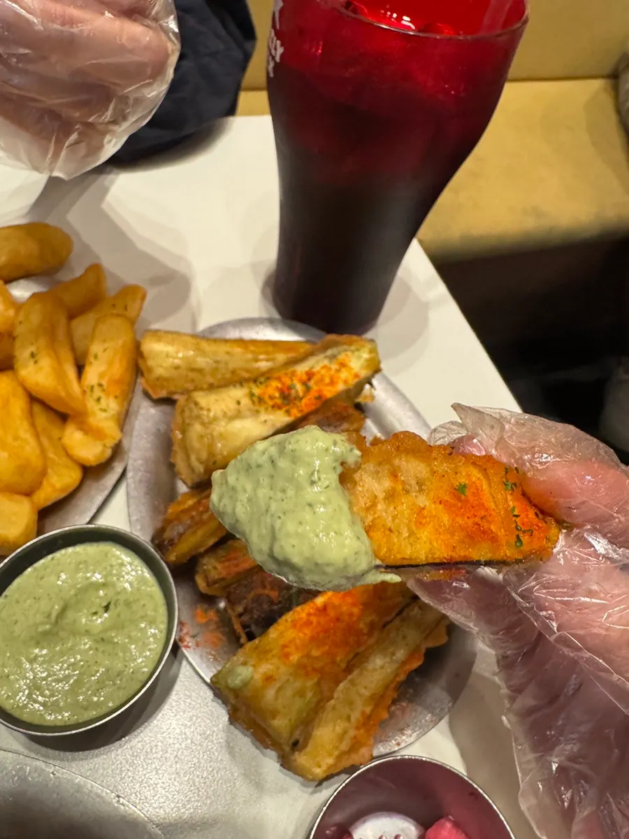 Thick eggplant fries served with green mayo sauce