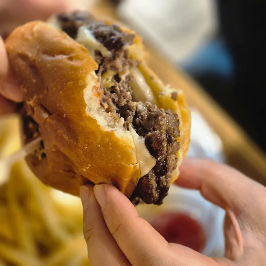 Cross-section of a bitten double cheeseburger