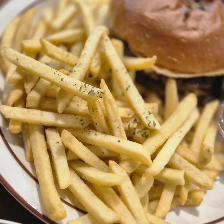 Table setup with burger and fries together