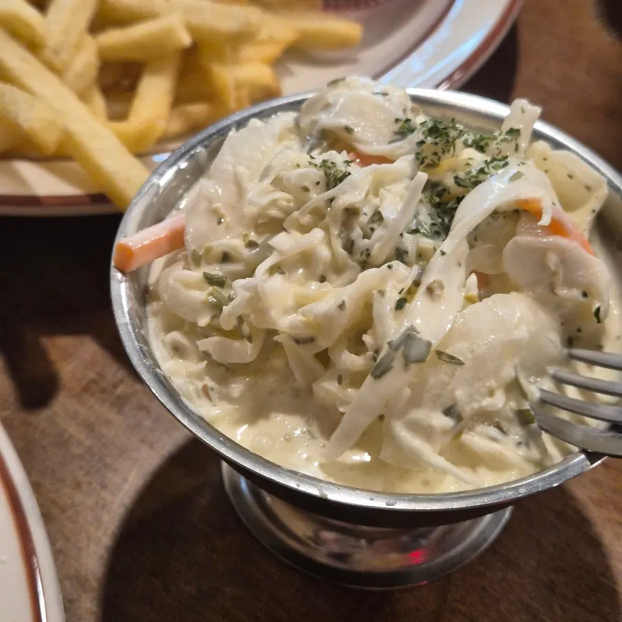 Bowl of coleslaw served as a side dish