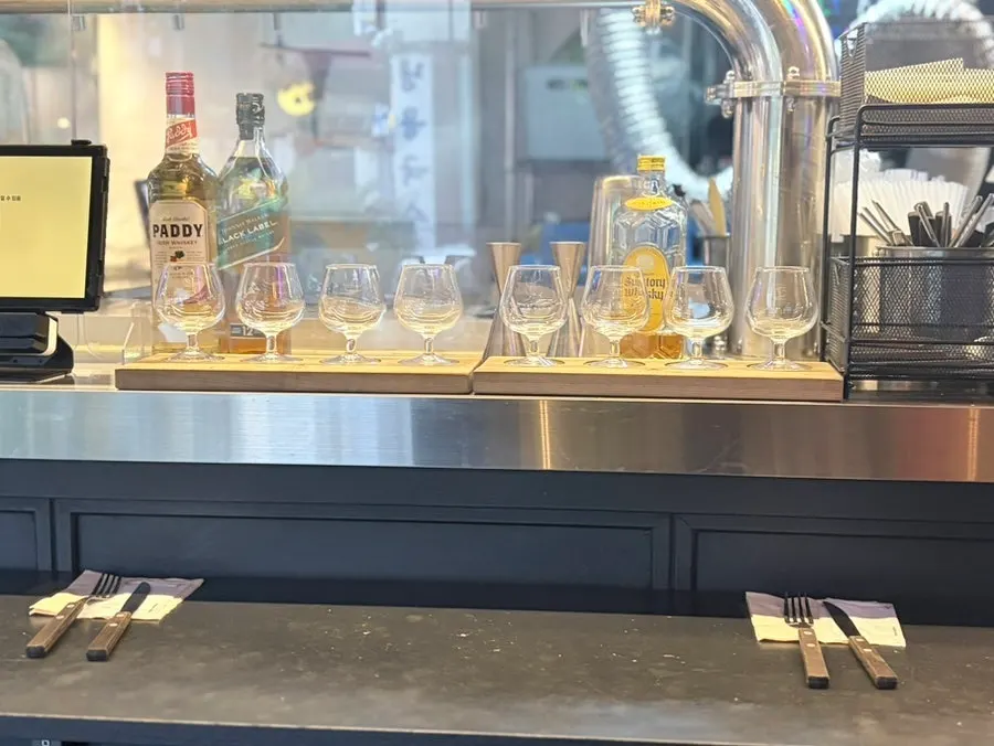 Interior shelf full of liquor bottles
