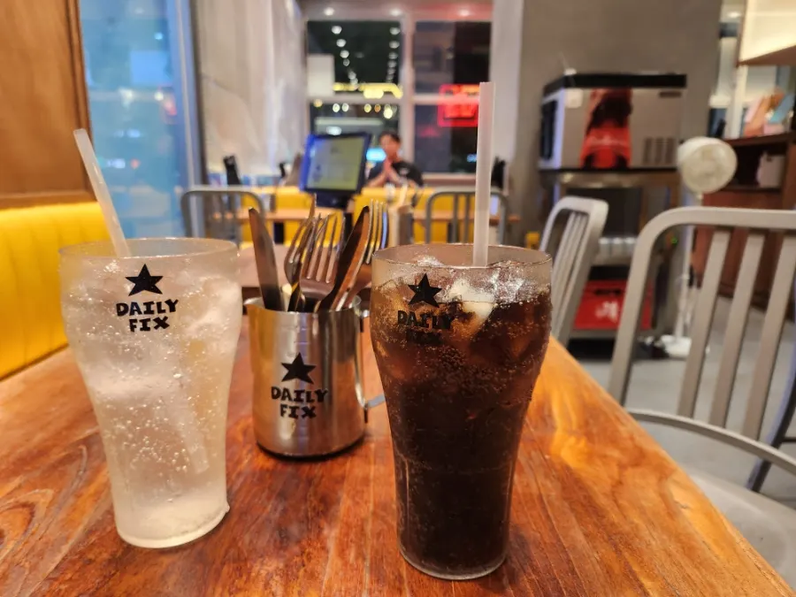 Knife and fork placed alongside the burger