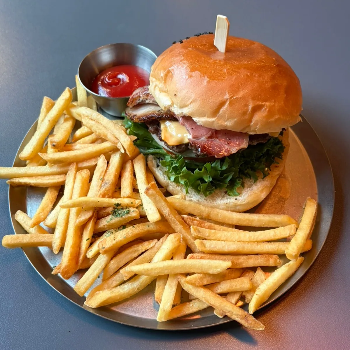 Two Hanwoo patty burgers and sides on the table