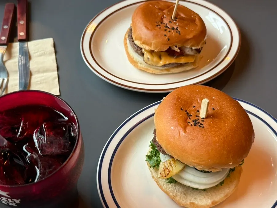 Choosing a burger from the menu at the table