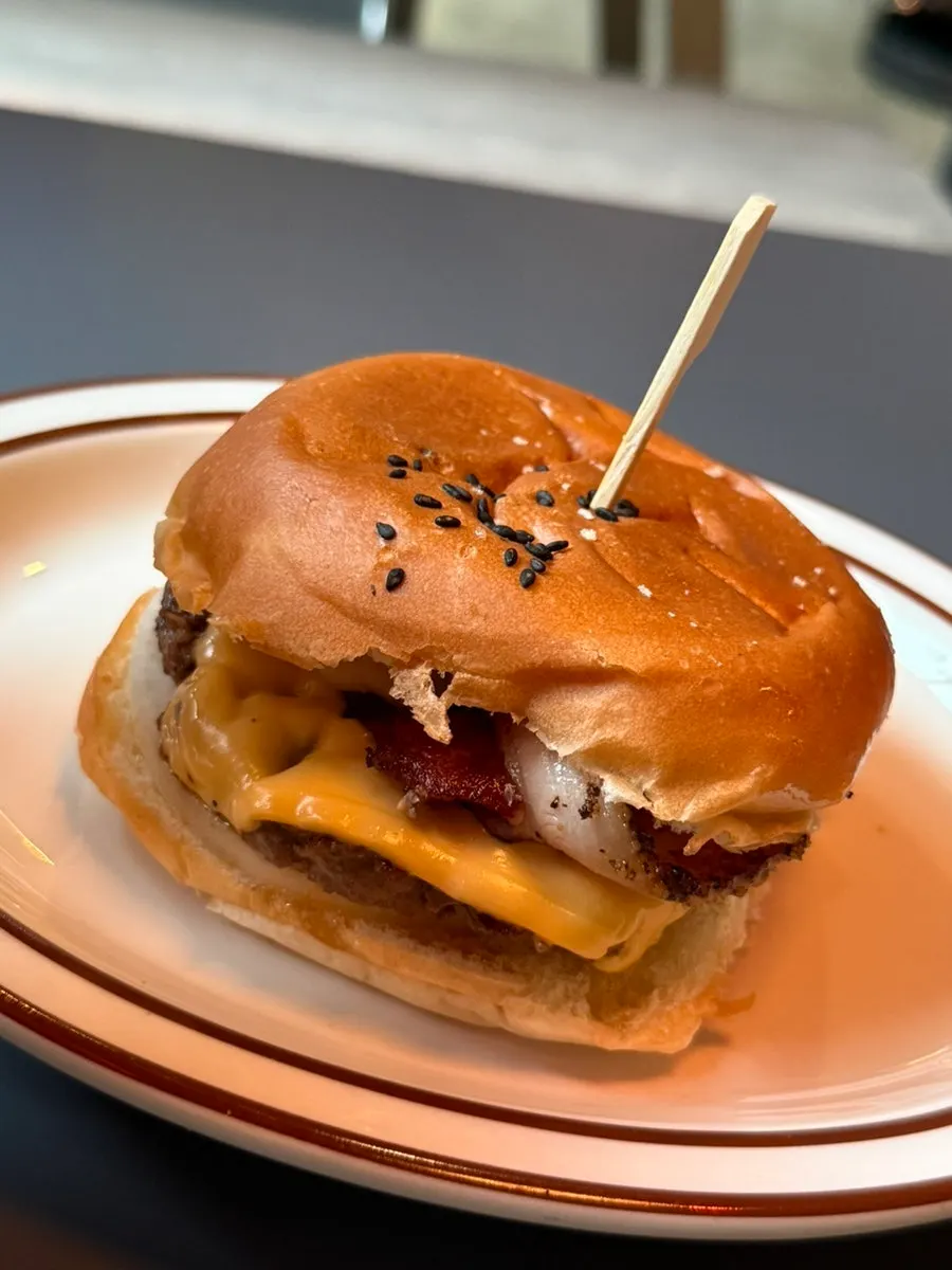 Table spread showing a thick-pattied burger