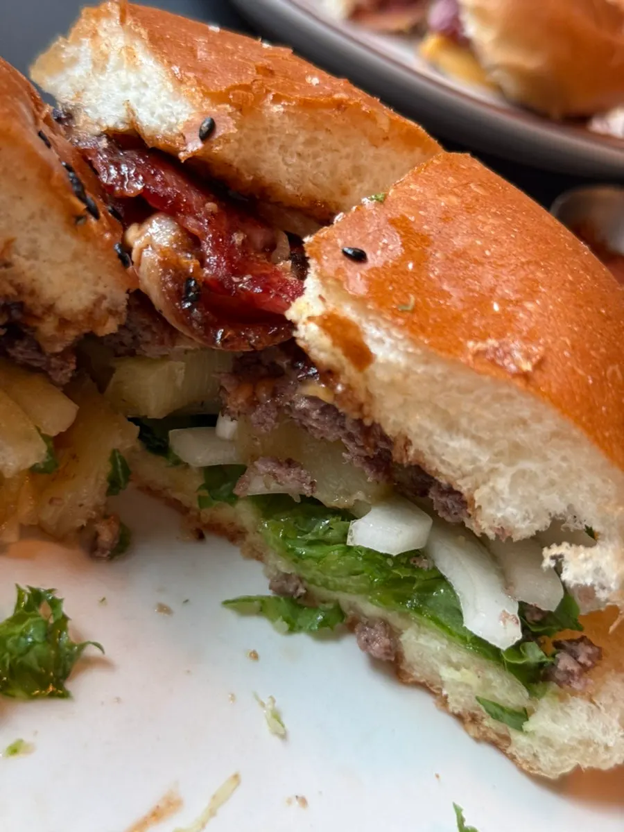 Hawaiian Bacon BBQ Burger topped with grilled pineapple