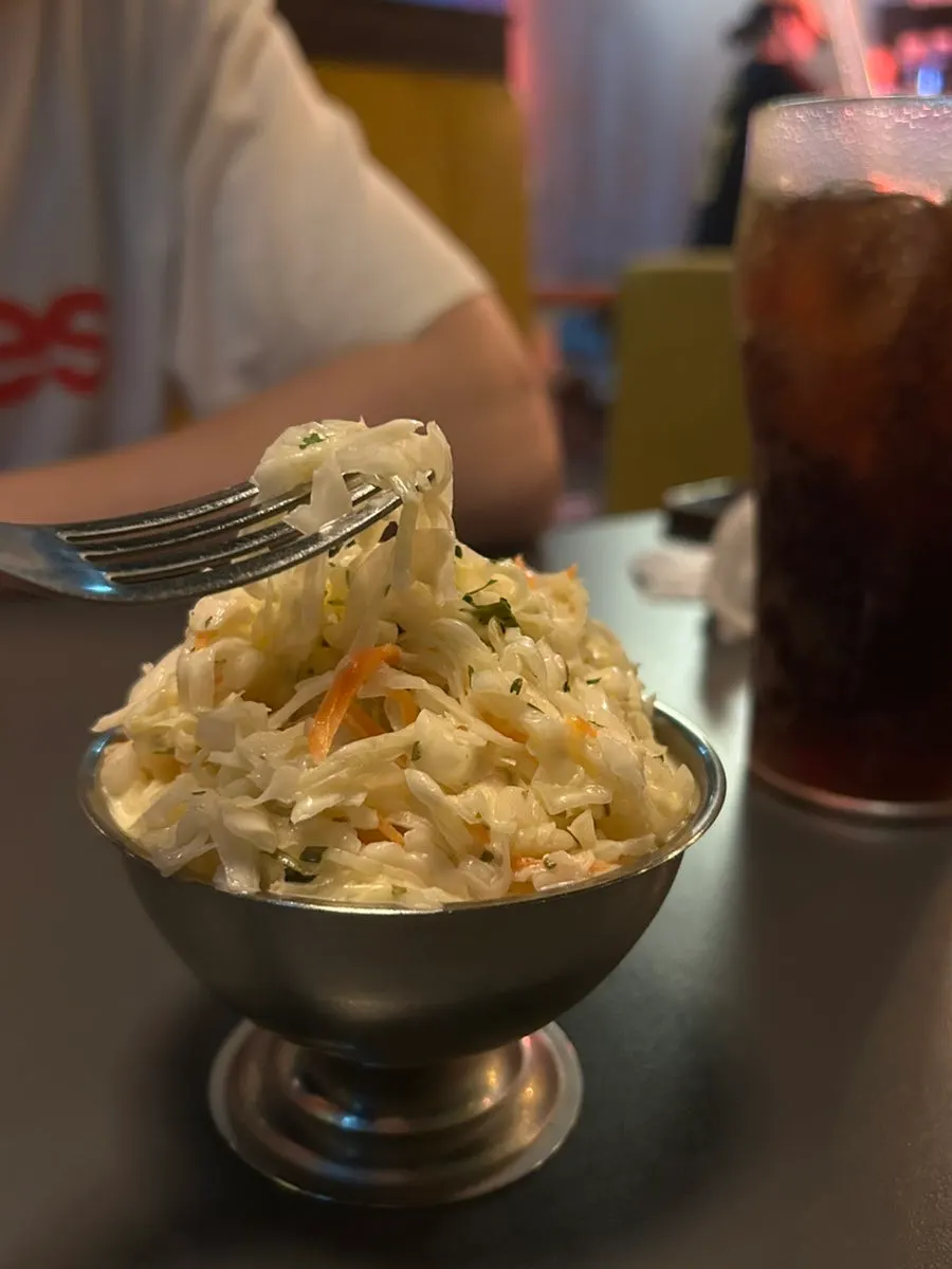 A tangy bite of coleslaw
