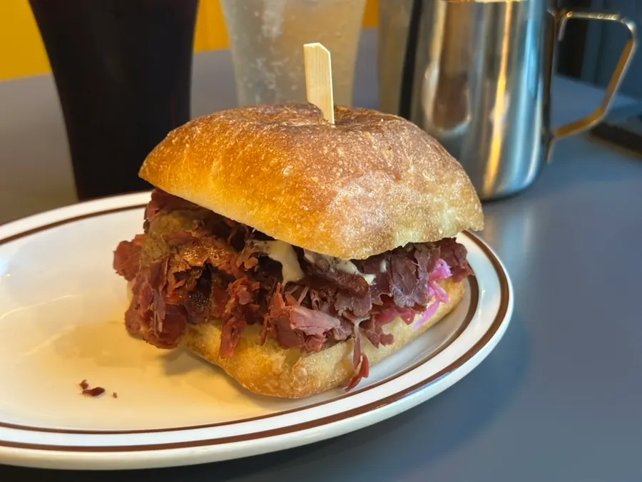 Plate with Daily Fix pastrami sandwich
