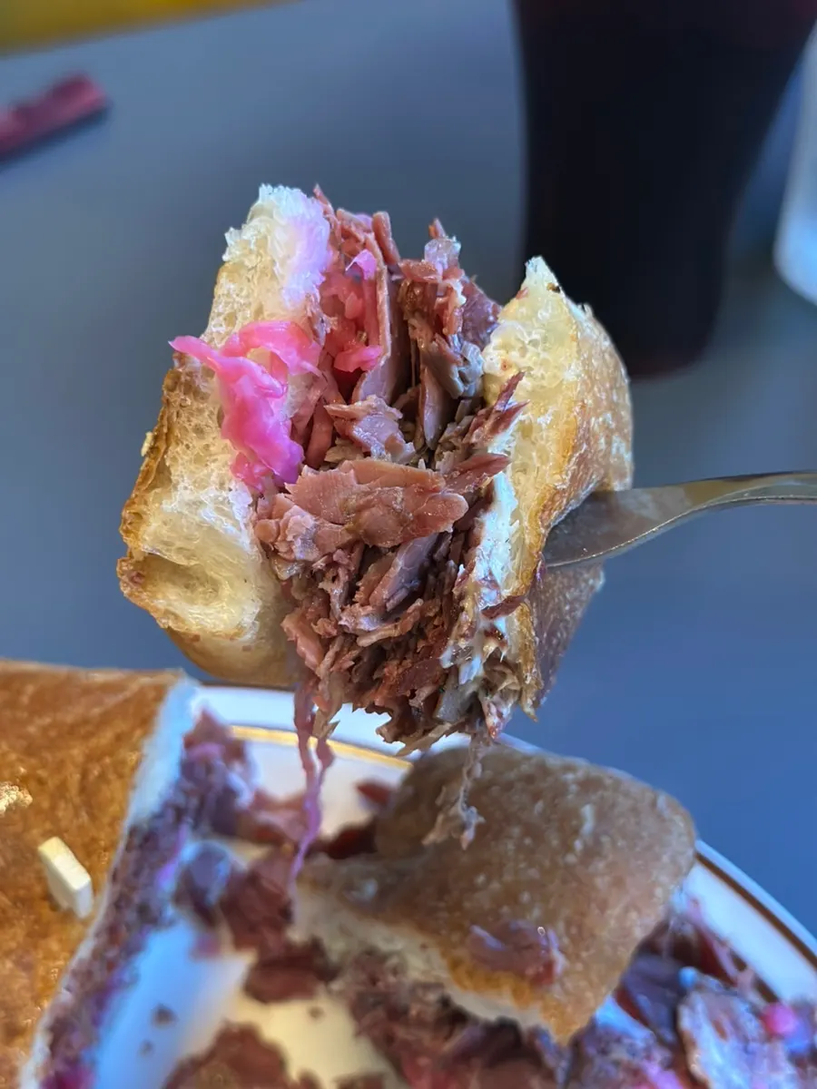 Close-up of the pastrami sandwich on a ciabatta bun