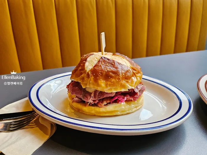 The pastrami sandwich and triple cheeseburger together