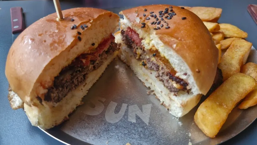 Cross-section of the halved bacon cheeseburger