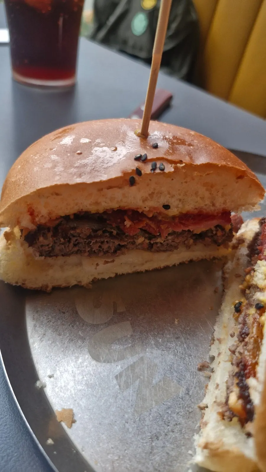 Bacon cheeseburger with cheese dripping down