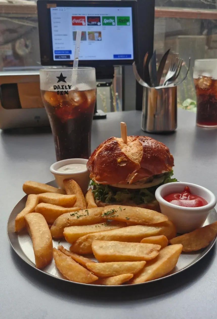 Pretzel bun classic burger loaded with vegetables