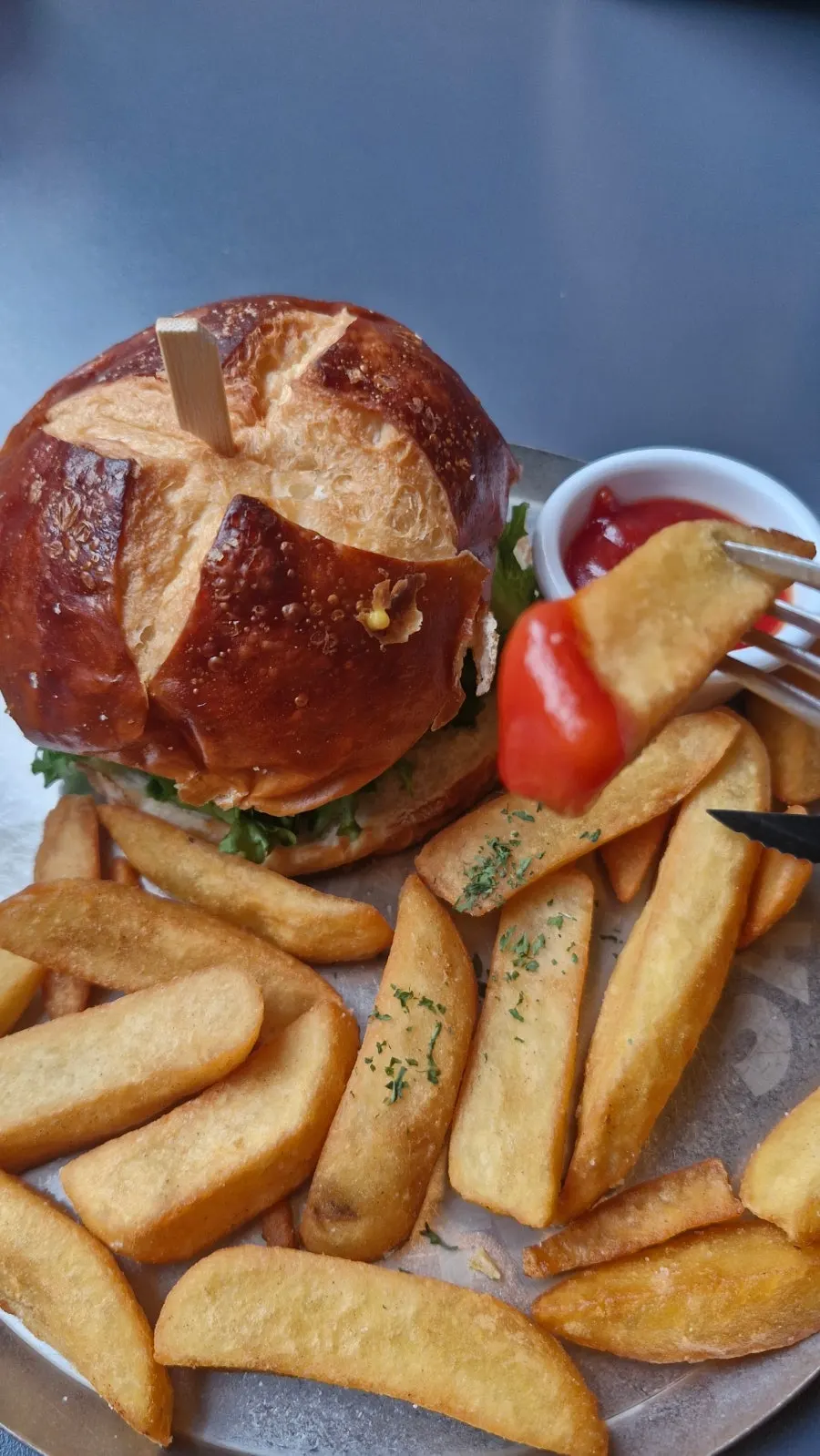 Close-up of the classic burger with pretzel bun swap