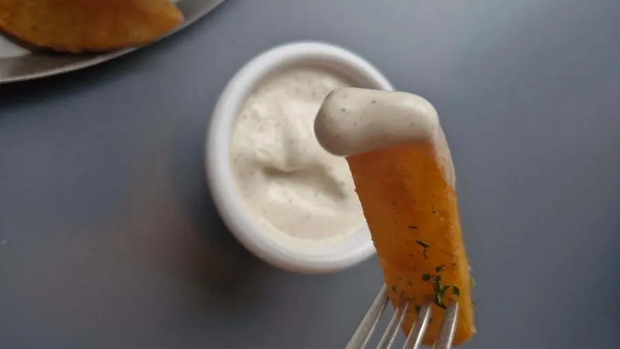 Fries dipped in ranch dressing