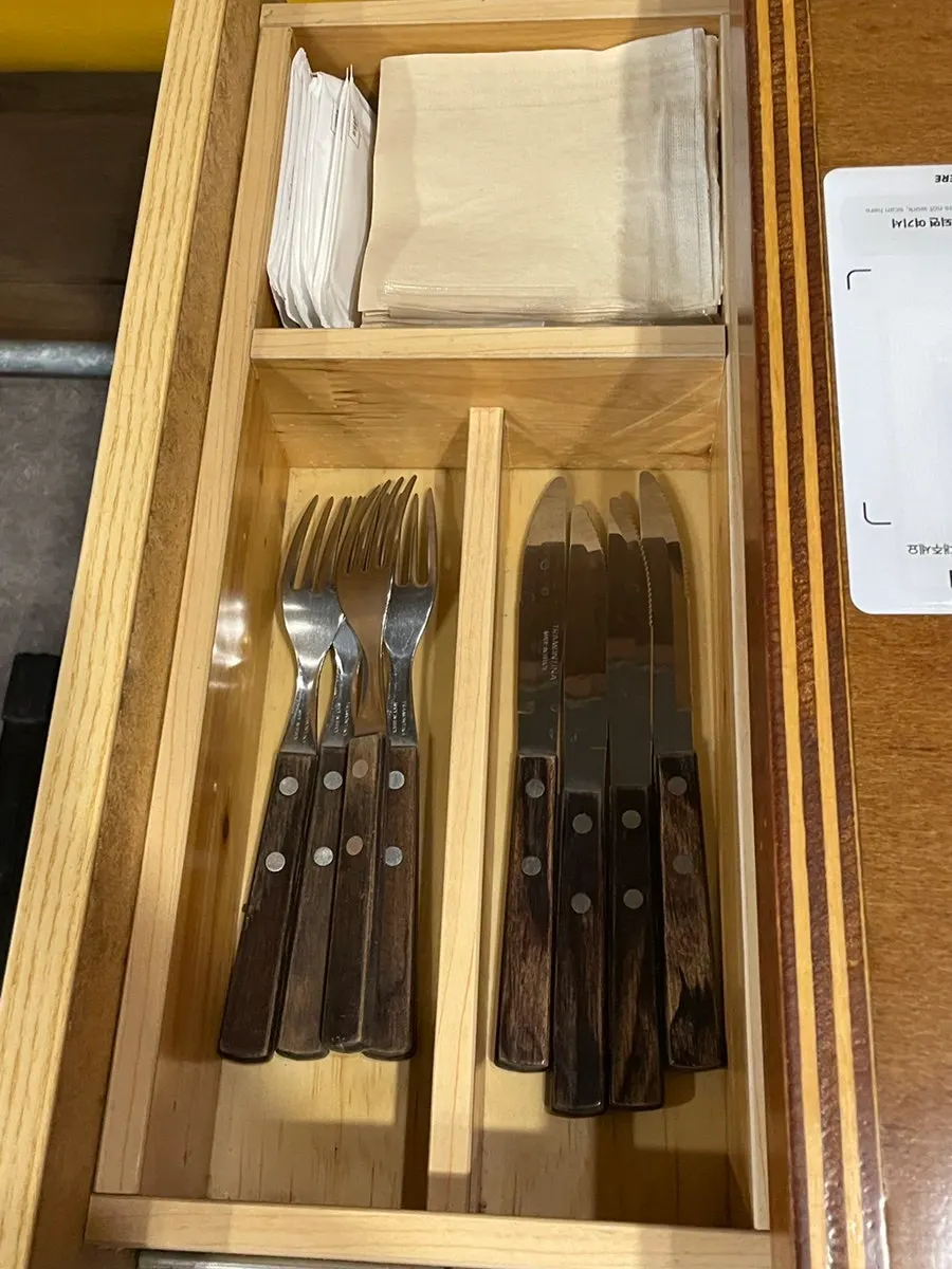 Table drawer with knife, fork and disposable gloves