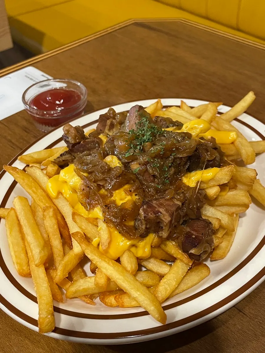 Bacon cheese fries piled high with bacon and cheese