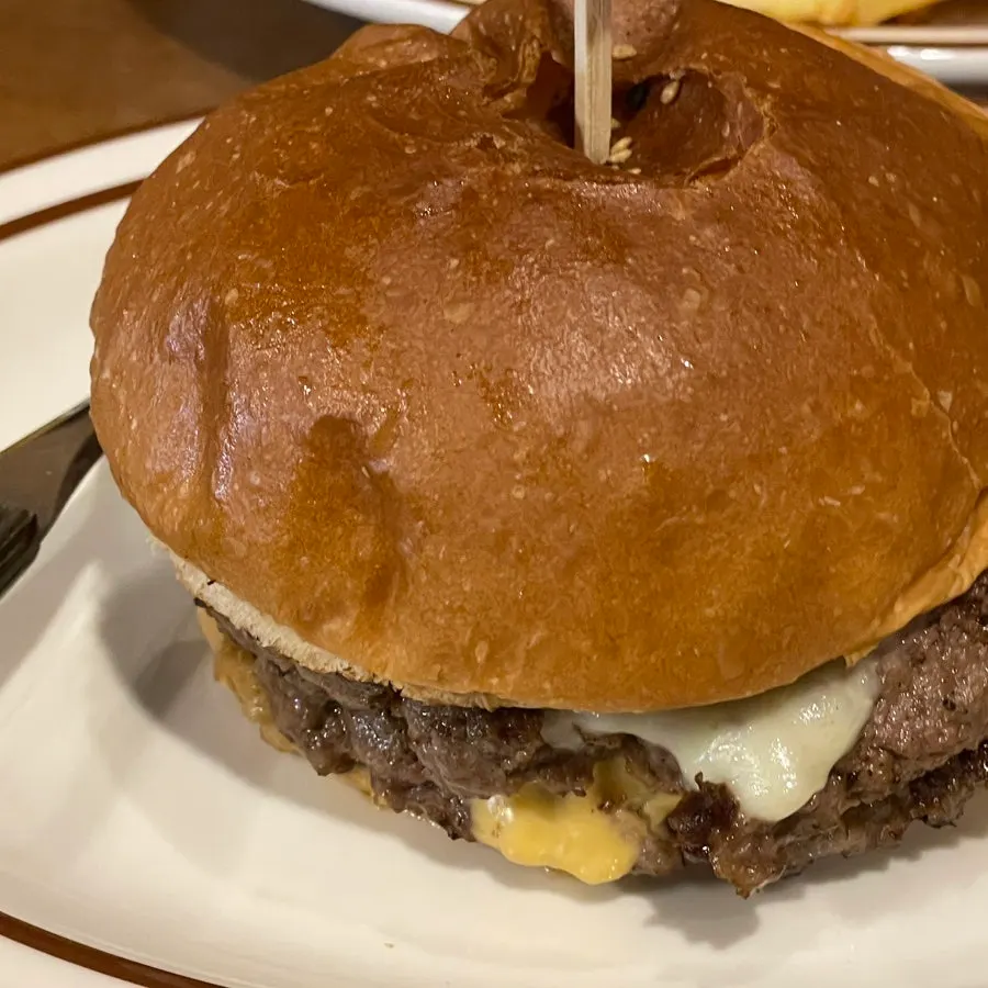 Cross-section of the burger with melted cheese between double patties